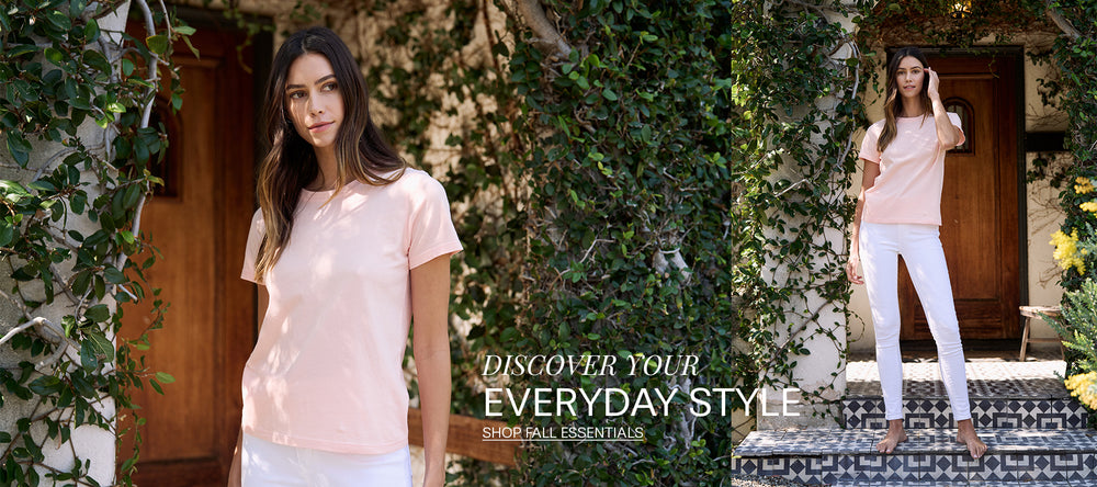 Woman in peach tee shirt and white pants outside of house standing in ivy covered walkway