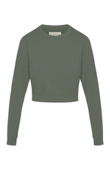 Woman’s crewneck cropped sweatshirt with drop shoulders and length to midriff made of organic and recycled cotton French Terry in color Thyme Green on mannequin 