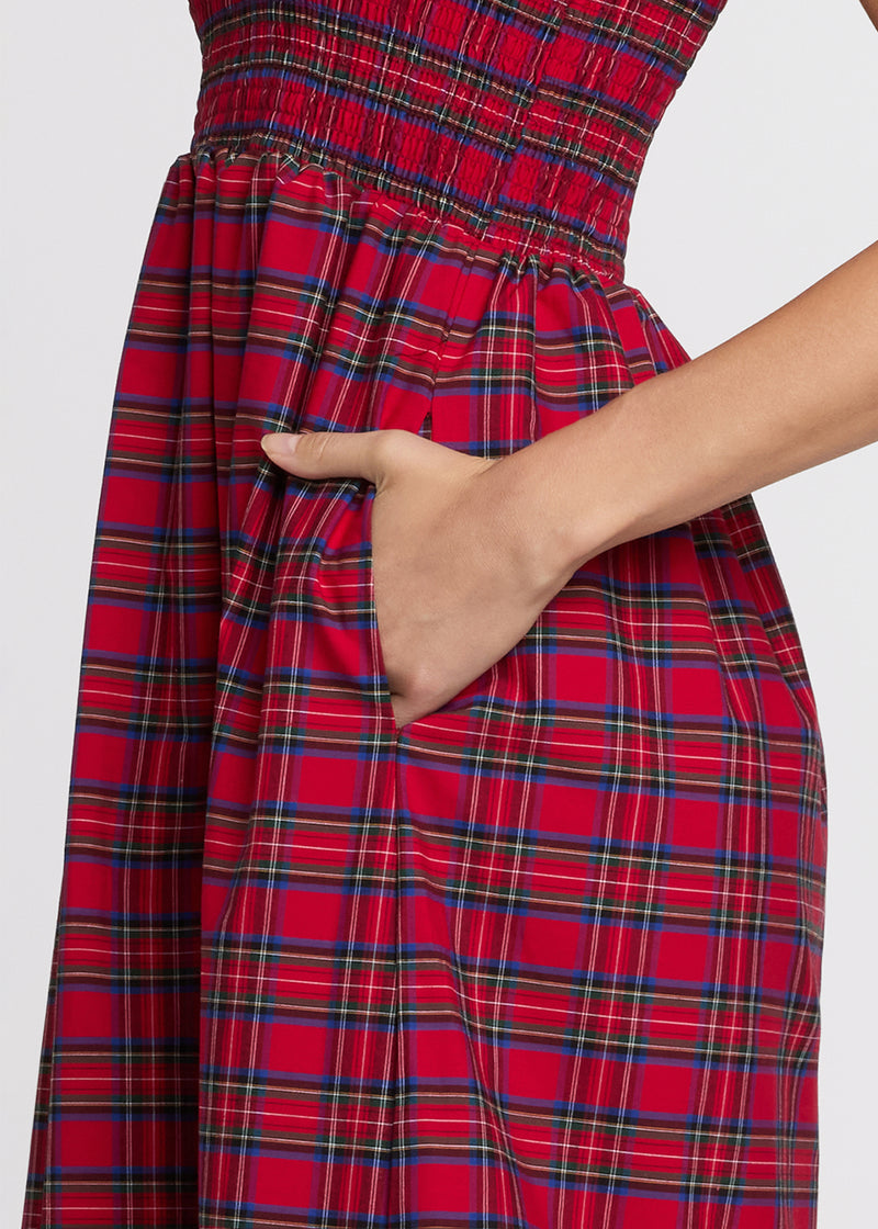 Red plaid dress with a hand in the pocket on a white background