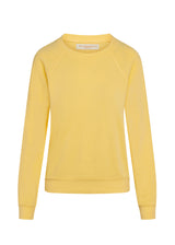 Women's yellow sweatshirt on mannequin. 
